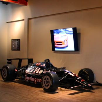 Foyt Wine Vault - Enjoy a glass of wine and some local cheeses next to AJ Foyt's 1991 Copenhagen IndyCar. They show vintage race footage on the TV. - Wine Bars Near Me - Indianapolis, Indiana