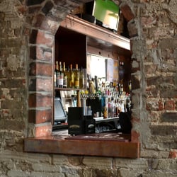 Rhinehaus - Interior shot of Rhinehaus to exemplify its charming interior featuring exposed brick.