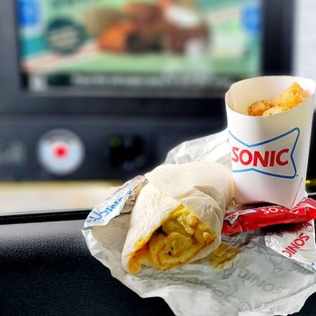 Sonic Drive-In - Sausage, egg & cheese burrito with zesty sauce and onion + small tots. Both super hot and freshly prepared - Burgers Near Me - Wilmington, North Carolina Sonic Drive-In - Sausage, egg & cheese burrito with zesty sauce and onion + small tots. Both super hot and freshly prepared - Burgers Near Me - Wilmington, North Carolina