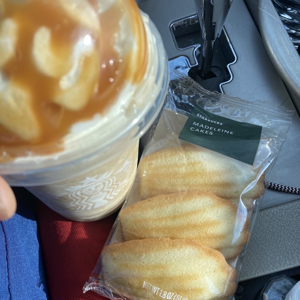 Starbucks - a person holding a cup of iced coffee and some donuts - Coffee & Tea Near Me - Baltimore, Maryland Starbucks - a person holding a cup of iced coffee and some donuts - Coffee & Tea Near Me - Baltimore, Maryland