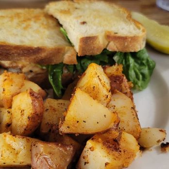 Famous Toastery - Tuscan chicken sandwich with house potatoes - Breakfast & Brunch Near Me - Concord, North Carolina Famous Toastery - Tuscan chicken sandwich with house potatoes - Breakfast & Brunch Near Me - Concord, North Carolina