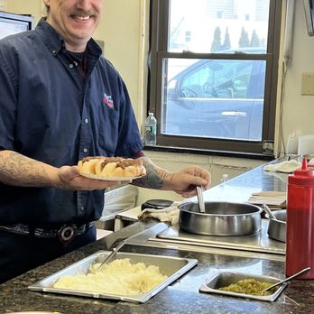 Hot Dog Charlie's - Happy dude fixing up my hotdog - Hot Dogs Near Me - Rensselaer, New York