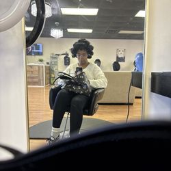 Cristina Dominican Hair Salon - Me in rollers at the salon while they add chemicals to my hair without my consent.
