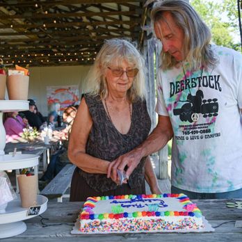 Deer Ridge Camping Resort - Pat and Scott cutting cake - Campgrounds Near Me - Richmond, Indiana Deer Ridge Camping Resort - Pat and Scott cutting cake - Campgrounds Near Me - Richmond, Indiana