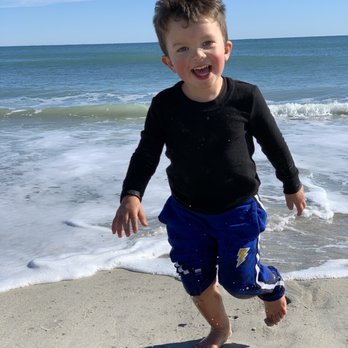 Kure Beach - Oh the joys of being chased by waves. - Beaches Near Me - Kure Beach, North Carolina