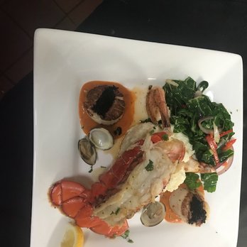 Sailor Jack's - Seafood Combination- Lobster, Clams,  Scallops,  and Prawns served with Lobster Sauce, Risotto,  and sauteed vegetables - Seafood Near Me - Benicia, California