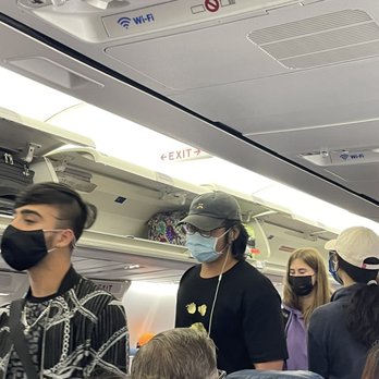 Delta Air Lines - Empty overhead bins - Airlines Near Me - San Diego, California Delta Air Lines - Empty overhead bins - Airlines Near Me - San Diego, California