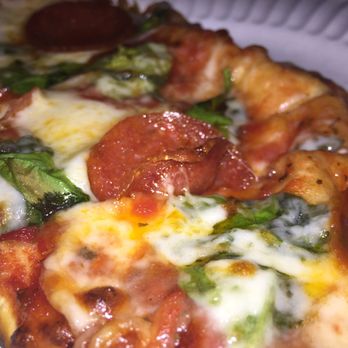 Pop's Blue Moon - a slice of pepperoni and spinach pizza - Dance Clubs Near Me - Saint Louis, Missouri