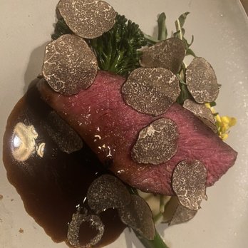 Restaurant Gish - Rare cooked steak with black truffles on top of broccolini and sweet potato mashed potatoes - New American Near Me - Santa Clara, California