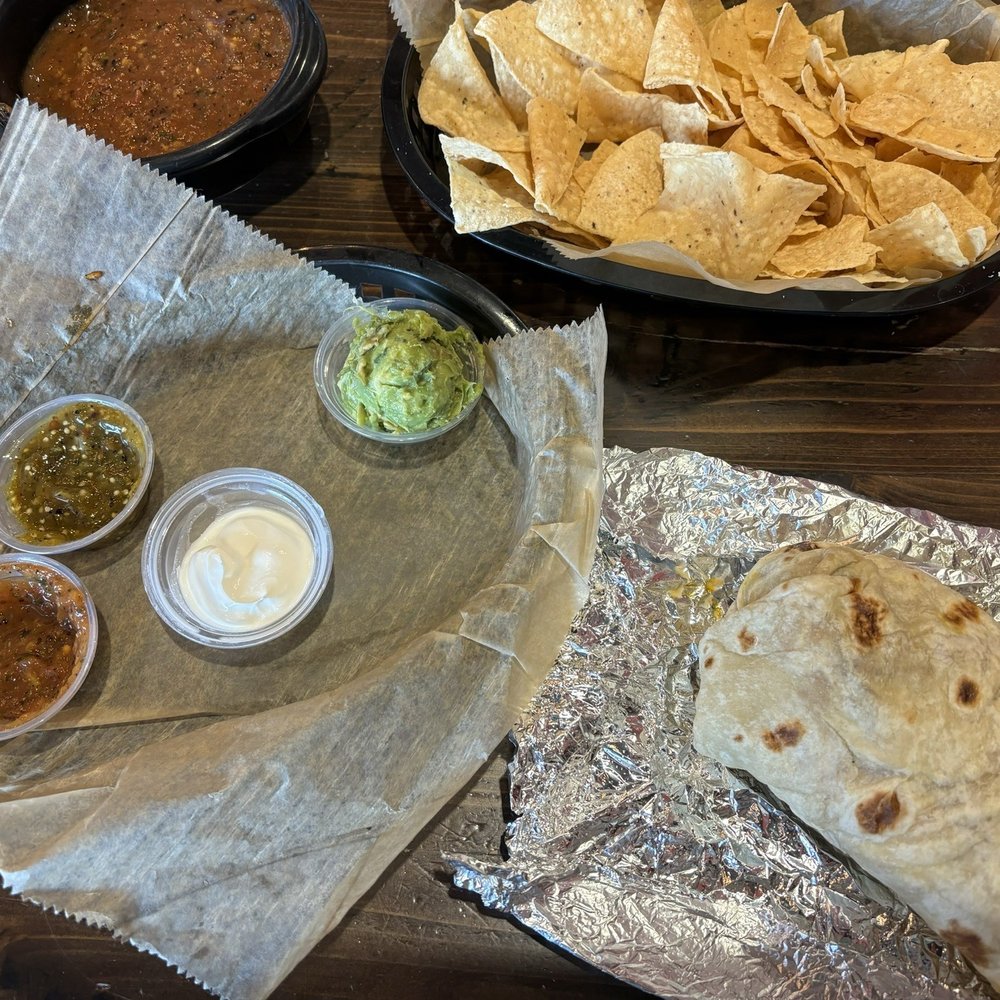 Torchy's Tacos - Chicken burrito with chips and salsa. - Tex-Mex Near Me - Fishers, Indiana Torchy's Tacos - Chicken burrito with chips and salsa. - Tex-Mex Near Me - Fishers, Indiana