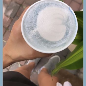 Alchemy Juice Cafe - a person holding a cup of coffee - Cafes Near Me - Austin, Texas Alchemy Juice Cafe - a person holding a cup of coffee - Cafes Near Me - Austin, Texas