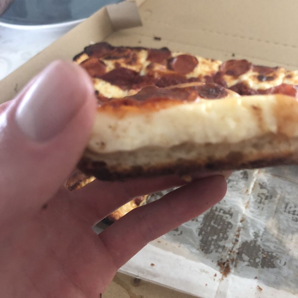 Detroit pizza with a ton of cheese Detroit pizza with a ton of cheese