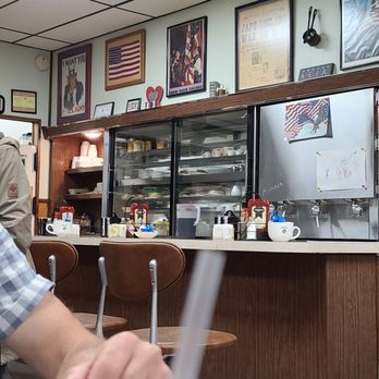 Grayling Restaurant - a man sitting at the counter - New American Near Me - Grayling, Michigan