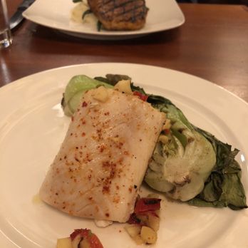 Cooks Tavern - Mahi mahi in front, Big Willy's Spice Rubbed Pork Chop in back - New American Near Me - Tacoma, Washington Cooks Tavern - Mahi mahi in front, Big Willy's Spice Rubbed Pork Chop in back - New American Near Me - Tacoma, Washington