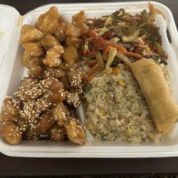 Kwangs Palace - Combo with sesame chicken, orange chicken, and Szechuan beef with fried rice, and a spring roll