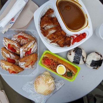 Cream Pan - The spread: katsu curry (large), onigiri, yakisoba dog, cream pan, strawberry croissants - Bakeries Near Me - Tustin, California