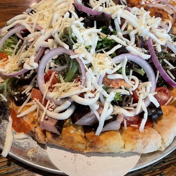 Mama Tigs Wood Fired Pizza - a pizza topped with cheese, olives, and other toppings - Pizza Near Me - Eufaula, Oklahoma Mama Tigs Wood Fired Pizza - a pizza topped with cheese, olives, and other toppings - Pizza Near Me - Eufaula, Oklahoma