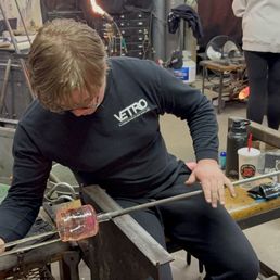 Shaping the glass piece by widening the glass piece.