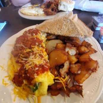 Dolli's Diner - Chilicheese omelet, bacon, house fries, and wheat toast. - Burgers Near Me - Nacogdoches, Texas Dolli's Diner - Chilicheese omelet, bacon, house fries, and wheat toast. - Burgers Near Me - Nacogdoches, Texas