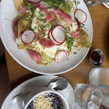 Poached Kitchen - Breakfast for our Saturday run was Green Chilaquiles with black beans. - Breakfast & Brunch Near Me - Irvine, California Poached Kitchen - Breakfast for our Saturday run was Green Chilaquiles with black beans. - Breakfast & Brunch Near Me - Irvine, California