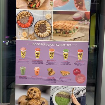 Booster Juice - a woman holding a plate of food - Juice Bars & Smoothies Near Me - Richmond Hill, Ontario
