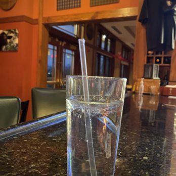 The Grumpy Goat - a glass of water on a bar - American Near Me - Elgin, Illinois
