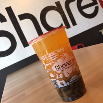 Sharetea - Mango passion fruit tea with mango and passion fruit bits already in there and added boba. Look at that boba to drink ratio! - Bubble Tea Near Me - Santa Ana, California