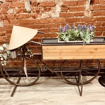 Pho Viet's - a bicycle with a basket of flowers - Vietnamese Near Me - Boston, Massachusetts