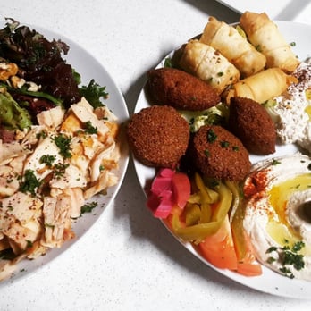Shawarma Grill & Cafe - Shwarma Grill Salad on the left and Appetizer Sampler on the right. - Mediterranean Near Me - Houston, Texas Shawarma Grill & Cafe - Shwarma Grill Salad on the left and Appetizer Sampler on the right. - Mediterranean Near Me - Houston, Texas