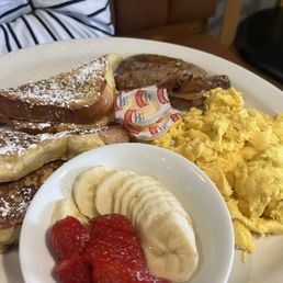 French Toast with sausage, eggs and fresh fruit French Toast with sausage, eggs and fresh fruit
