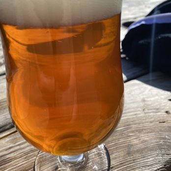 Midtown Yacht Club - a glass of beer on a wooden table - Food Trucks Near Me - Bend, Oregon Midtown Yacht Club - a glass of beer on a wooden table - Food Trucks Near Me - Bend, Oregon