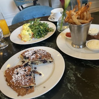 Café Riggs - Blueberry pancakes (whoops took a few bites before the photo), eggs royale, and steak frites - Breakfast & Brunch Near Me - Washington, DC, District of Columbia Café Riggs - Blueberry pancakes (whoops took a few bites before the photo), eggs royale, and steak frites - Breakfast & Brunch Near Me - Washington, DC, District of Columbia