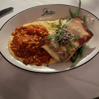 Sinatra Bar & Lounge - Blackened salmon topped with a citrus beurre blanc sauce. Served on a bed of tomato fregola, green beans, and summer corn puree. - Italian Near Me - Nashville, Tennessee