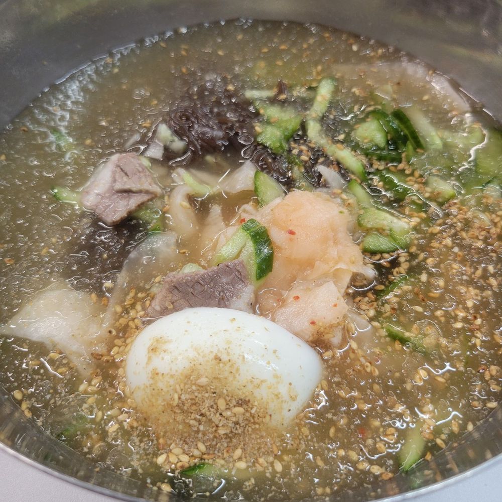 Yoo's Place - Icy, refreshing chic mul naengmyun (cold noodle soup). The staff will cut the uber-chewy noodles for you to make it easier to eat. - Korean Near Me - Irvine, California Yoo's Place - Icy, refreshing chic mul naengmyun (cold noodle soup). The staff will cut the uber-chewy noodles for you to make it easier to eat. - Korean Near Me - Irvine, California