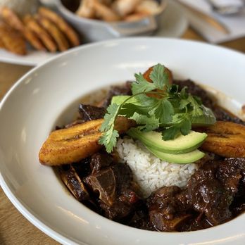 Valley Fresh - Hacked menu: Oxtail flavored goat, sweet plantains, with white rice and avocado. - American Near Me - West Orange, New Jersey Valley Fresh - Hacked menu: Oxtail flavored goat, sweet plantains, with white rice and avocado. - American Near Me - West Orange, New Jersey