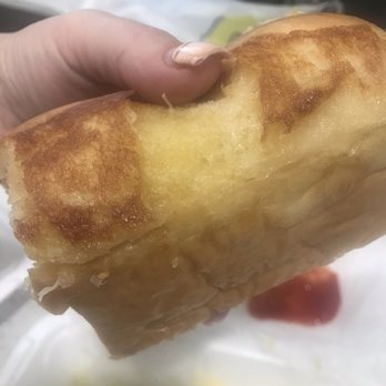 Dough Dough's Donuts - a person holding a donut - Food Trucks Near Me Dough Dough's Donuts - a person holding a donut - Food Trucks Near Me