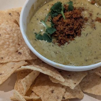 Flower Child - Green Chile Queso with chickpea chorizo, white cheddar and yellow corn chips - Salad Near Me - Del Mar, California