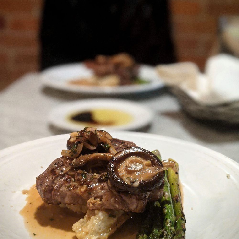 Mizuna - Grilled All Natural New York Strip on gorgonzola mash with asparagus drizzled with mushroom marsala sauce - New American Near Me - Spokane, Washington