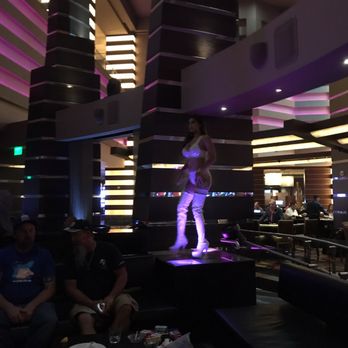 Pleasure Pit - a woman standing on a stage - Adult Entertainment Near Me - Las Vegas, Nevada