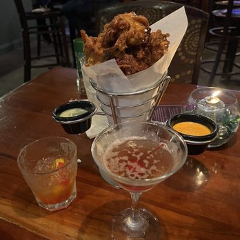 Braised Onion - Onion fritters were a bit greasy but full of flavor! Cocktails were delightful and well made! - New American Near Me - Ocala, Florida Braised Onion - Onion fritters were a bit greasy but full of flavor! Cocktails were delightful and well made! - New American Near Me - Ocala, Florida