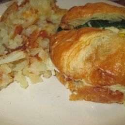 BEC with spinach on croissant and home fries. BEC with spinach on croissant and home fries.