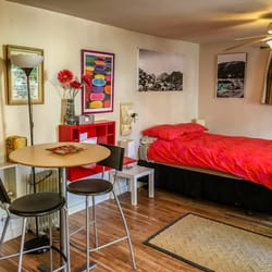 Above and Beyond Rentals - Little Red House Studio with queen bed.