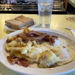 3 eggs, potatoes, bacon and toast
