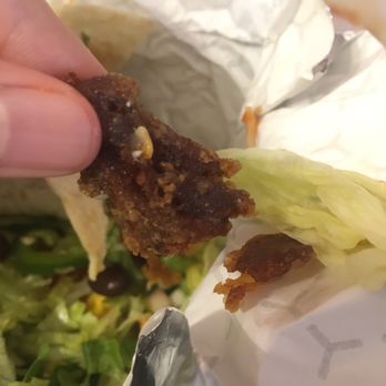 Grande Burrito - burnt pieces of "fish"...... - Mexican Near Me - Toronto, Ontario