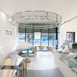 Bright, modern cafe space with clean seating, perfect for coffee, matcha, working, studying, or meeting with friends