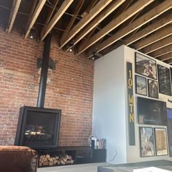 The Timberline - Fireplace, art wall, and hidden tv.