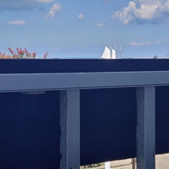 Yorktown Beach Hotel - Another seated veiw from 2nd floor room balcony. See the pretty ship sails? - Hotels Near Me - Yorktown, Virginia Yorktown Beach Hotel - Another seated veiw from 2nd floor room balcony. See the pretty ship sails? - Hotels Near Me - Yorktown, Virginia