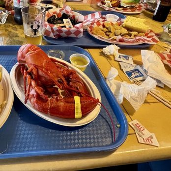 Lobster dinner with corn and mussels, fried pickles and a giant cheeseburger.