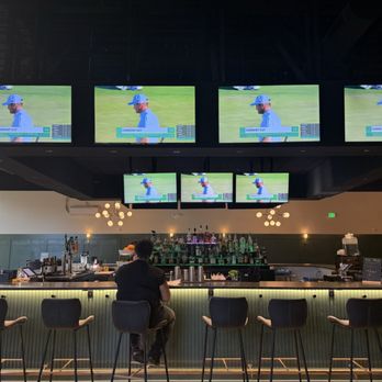 Clubhouse - Bar area, big screen TV's. They also have a really nice seating area outside with big screen TV's (I didn't get a picture) - Sports Bars Near Me - Greensboro, North Carolina Clubhouse - Bar area, big screen TV's. They also have a really nice seating area outside with big screen TV's (I didn't get a picture) - Sports Bars Near Me - Greensboro, North Carolina