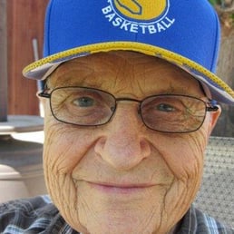 an older man wearing a hat and glasses an older man wearing a hat and glasses